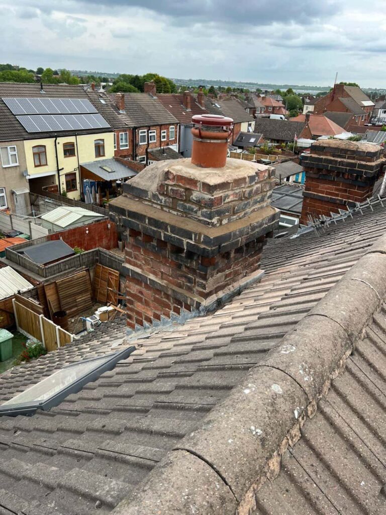 This is a photo taken from a roof which is being repaired by Littleport Roofing Repairs, it shows a street of houses, and their roofs